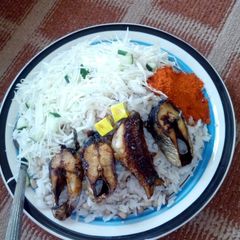 A picture of Rice n beans/fish n cabbage.