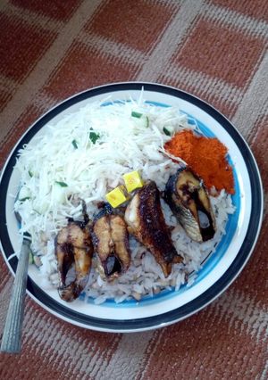 A picture of Rice n beans/fish n cabbage.