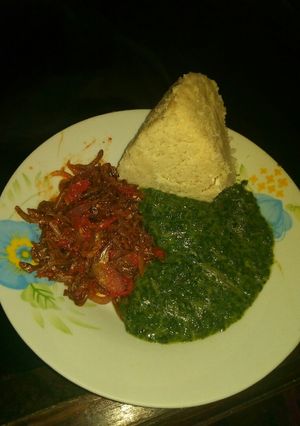 A picture of Omena fried, pumpkin leaves mixed with mrenda and ugali.