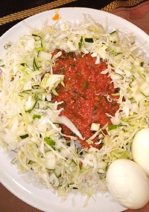 A picture of Rice with spring onion stew.
