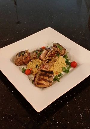 A picture of Grilled Lamb Chops with Parmesan Garlic Herb Couscous.