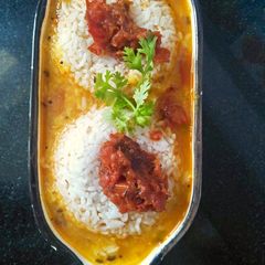 A picture of Daal rice with tomato chutney.