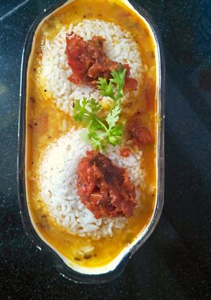 A picture of Daal rice with tomato chutney.