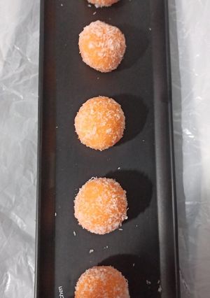 A picture of Orange Coconut ladoos.