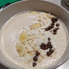 A picture of Coconut Banana peanut butter smoothie bowl for breakfast.