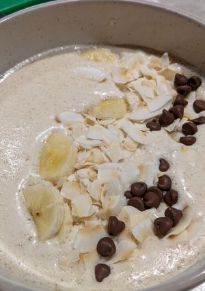 A picture of Coconut Banana peanut butter smoothie bowl for breakfast.