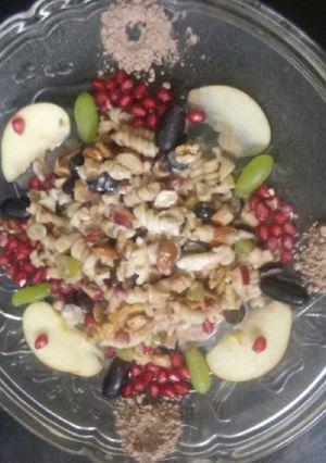 A picture of Pasta Fruit Salad with chocolate powder.