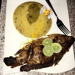 A picture of Cous-cous and grilled tilapia.