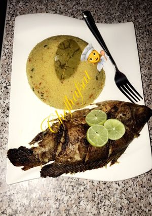 A picture of Cous-cous and grilled tilapia.