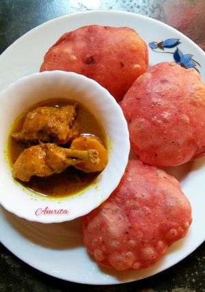 A picture of Beetroot Kachori with Chicken curry.
