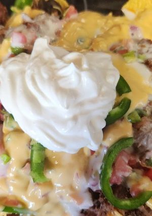A picture of 4 Cheese loaded nachos.