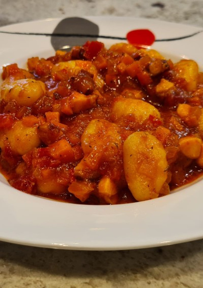 Una foto de Ñoquis con boloñesa de pulpo