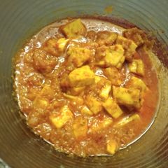 A picture of Paneer with Tomato Gravy.