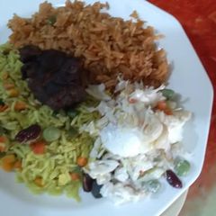 A picture of Mixed Rice and coleslaw.