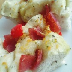 A picture of Focassia- ham and basil.