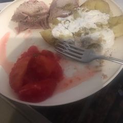 A picture of Pork roast with cinnamon apples.