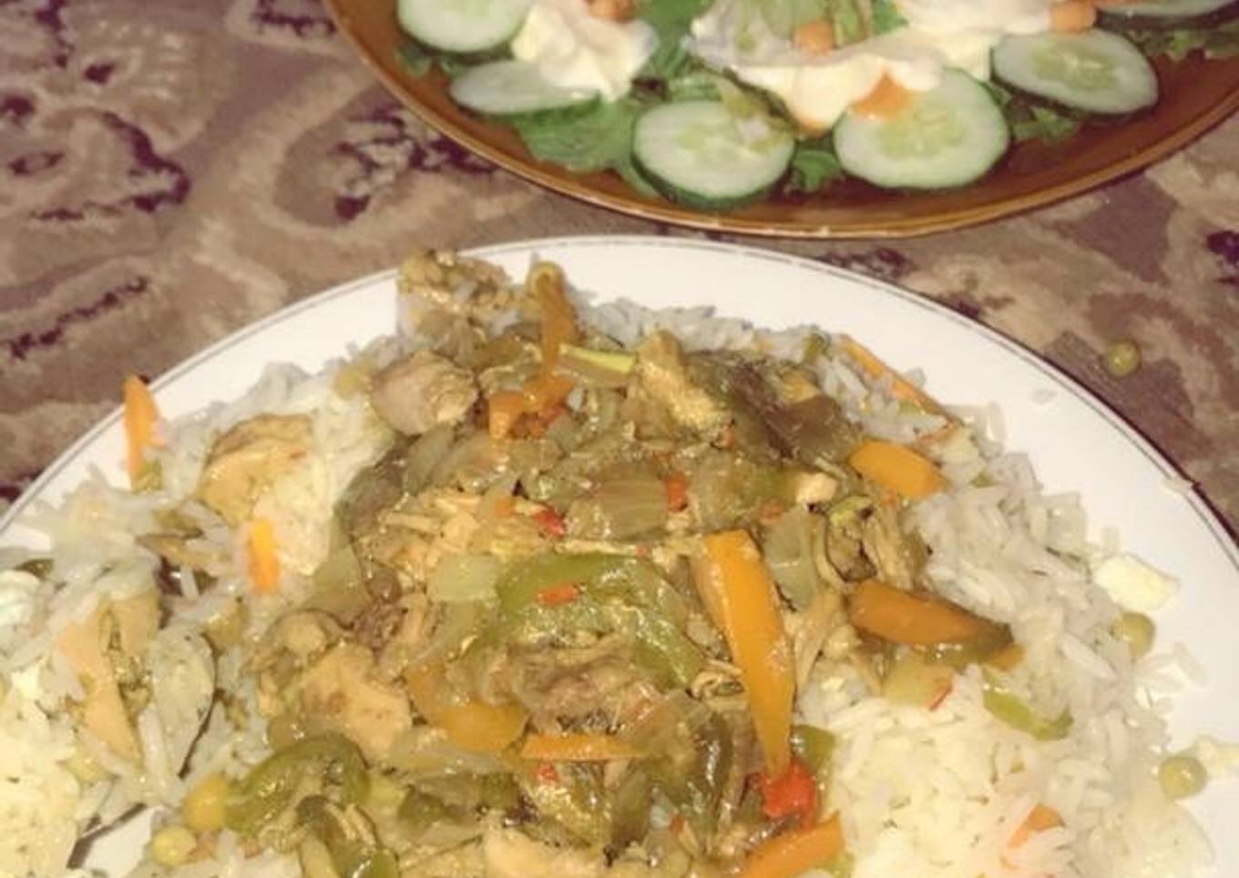 Chinese rice with chicken sauce and salad