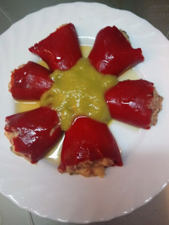 A picture of Stuffed Piquillo Peppers with Green Pepper Sauce.
