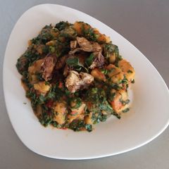 A picture of Yam Porridge with Barbequed Chicken.