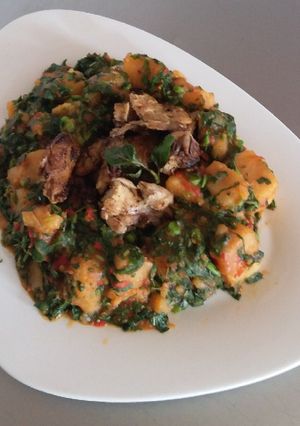 A picture of Yam Porridge with Barbequed Chicken.