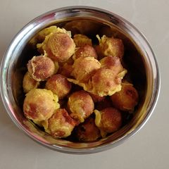 A picture of Munthiri kotthu.A snack made from green gram daal & jaggery.