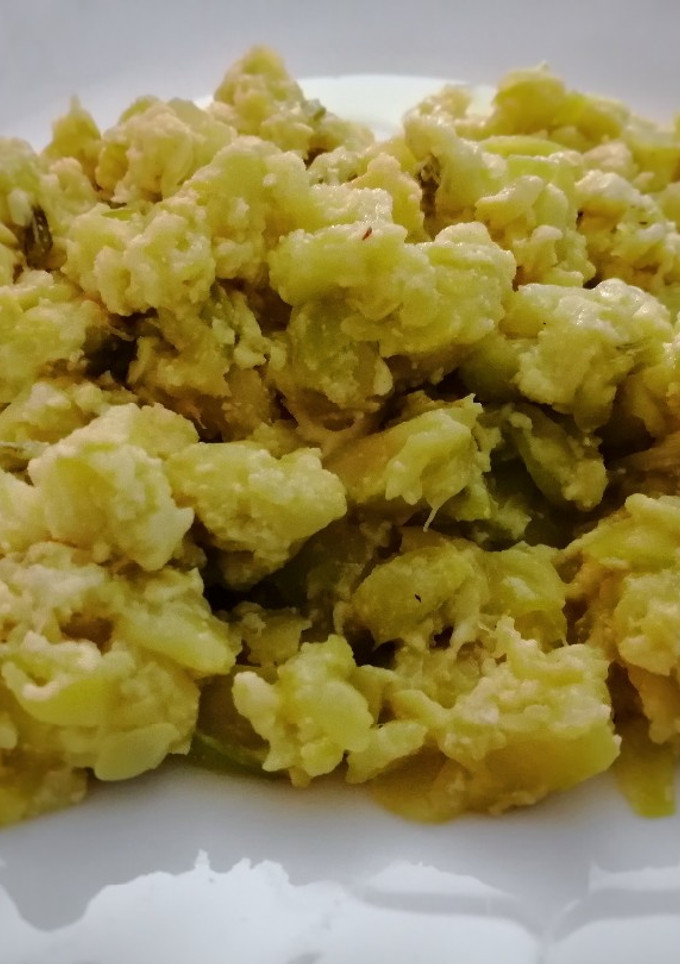 Una foto de Zucchini (zapallo o calabacín) con quesitos
