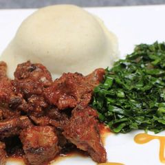 A picture of Ugali, Lamb and kales.