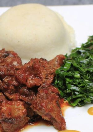 A picture of Ugali, Lamb and kales.