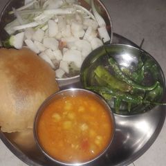 A picture of White chana with puri.