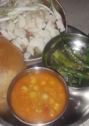 A picture of White chana with puri.