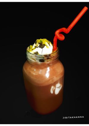 A picture of Chocolate Milkshake with Vanilla Ice-cream.