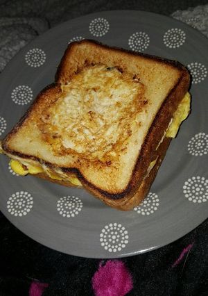 A picture of Ham n cheese egg n a basket.