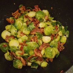 A picture of Honey glazed Brussels sprouts with bacon.