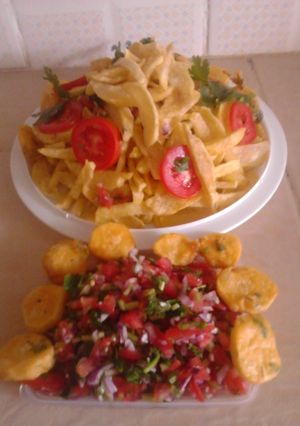 A picture of Fried chips with kachumbari.