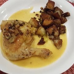 A picture of Saffron Chicken with olives.