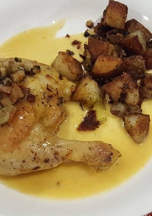 A picture of Saffron Chicken with olives.