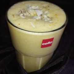 A picture of Orange dry fruit lassi.