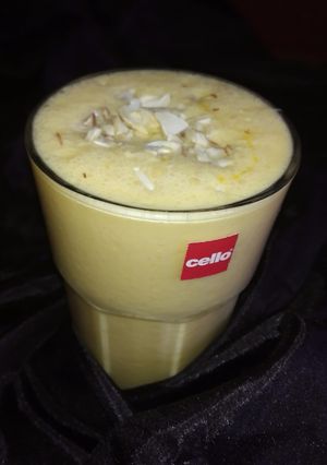 A picture of Orange dry fruit lassi.