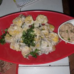 A picture of Matoke steamed with groundnuts sauce.