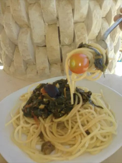 A picture of Spaghetti with Spinach and Tomatoes.