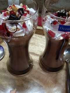 A picture of Chocolate milkshake with cream.