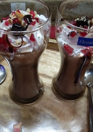 A picture of Chocolate milkshake with cream.