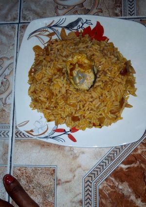 A picture of Palm oil rice with mackerel.