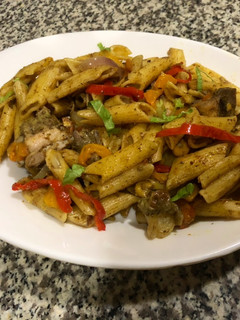 A picture of Mac and bell peppers stir fry.