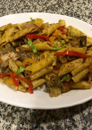 A picture of Mac and bell peppers stir fry.