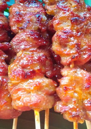 A picture of Grilled Pork Skewers with Fresh Coconut Milk (10 Baht per Skewer).