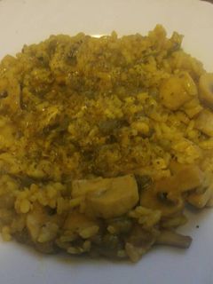 Una foto de Arroz meloso con champiñones vegana