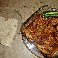 A picture of Hot and spicy chicken with chapati.
