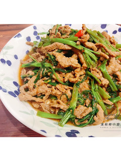 A picture of Stir-Fried Water Spinach with Sacha Beef.