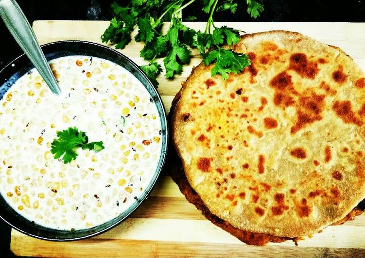 Alu paneer paratha serve with boondi raita